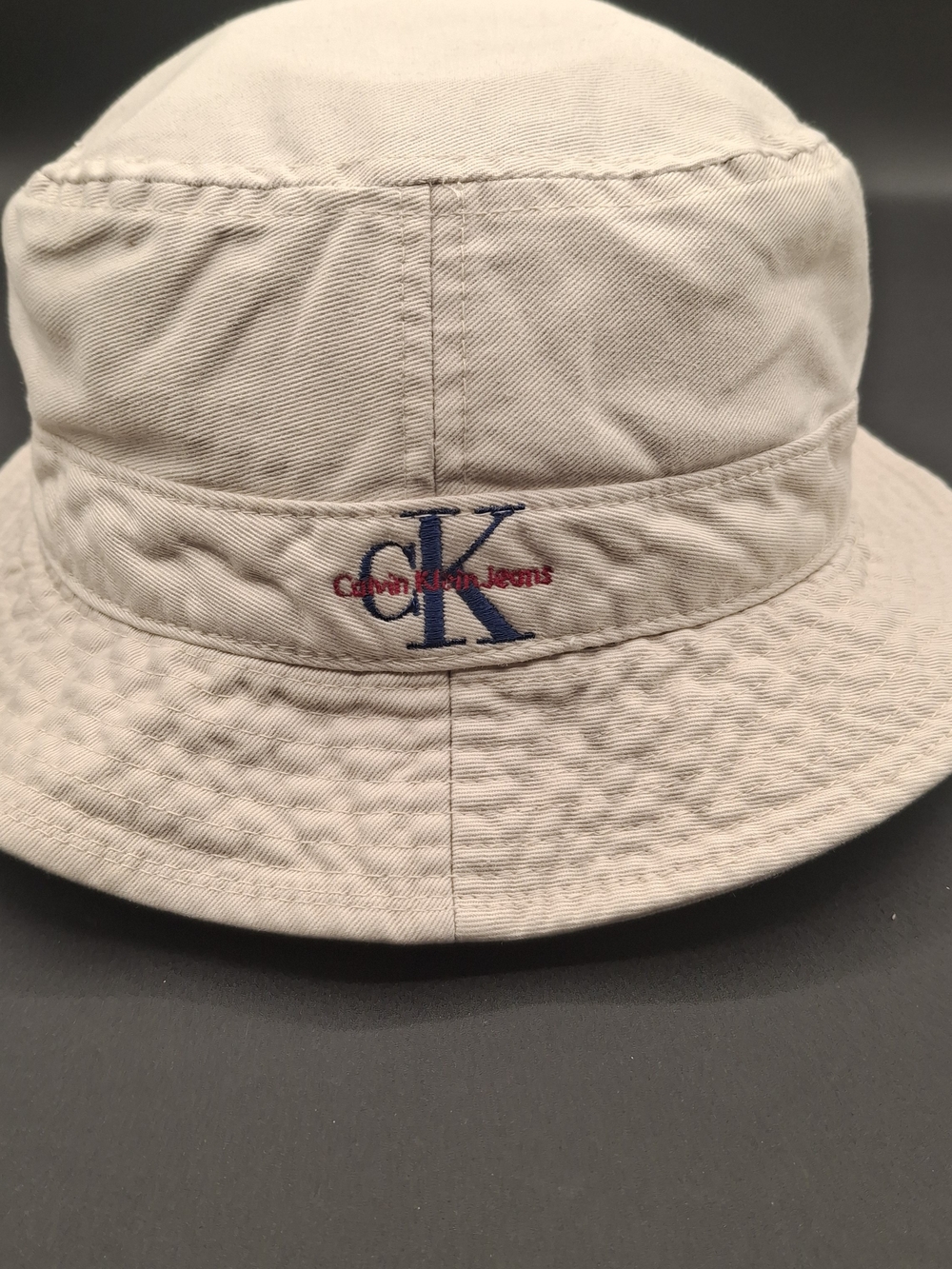 Calvin Klein Mens  Light Beige Bucket Hat with Navy & Red Logo